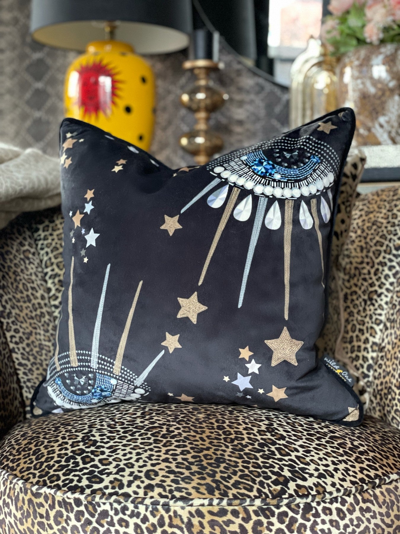 Jewel eye cushion with stars moon all seeing eye. Celestial eye black velvet cushion horoscope feather cushion. Neon leopard art print pink and purple with lightening bolts. Gallery wall art work art prints. Eclectic decor quirky unusual home accents.