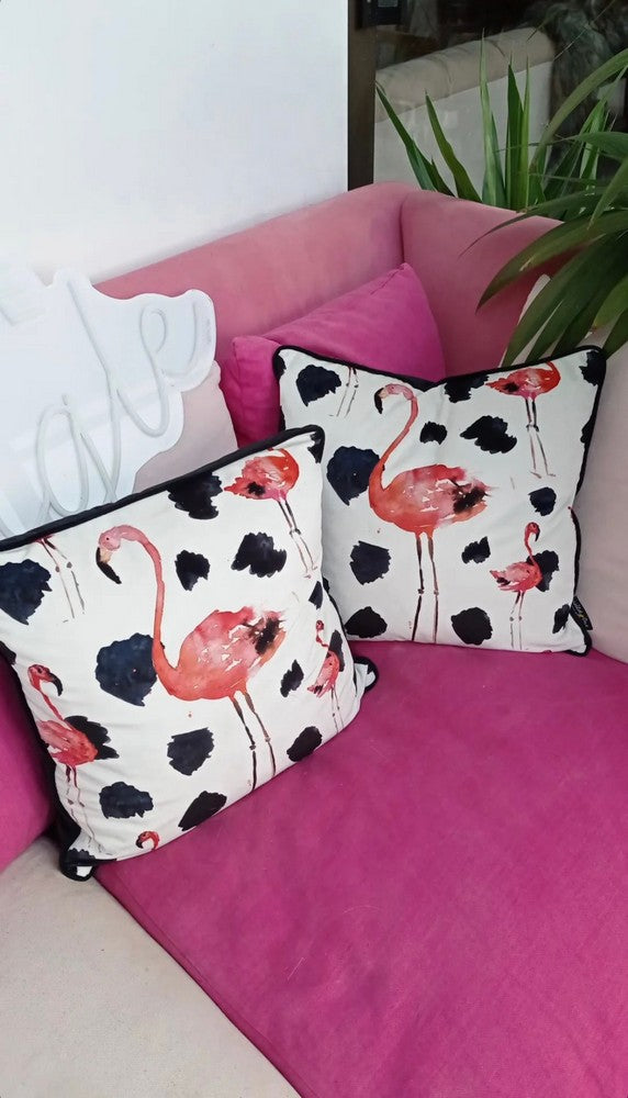 Flamingo velvet cushions with paint splash. Pink flamingos with monochrome dalmatian print.